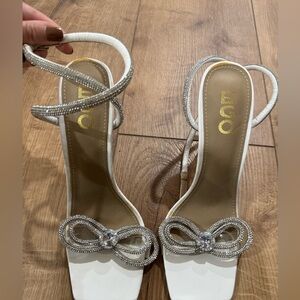 Aldo White and Silver Heels